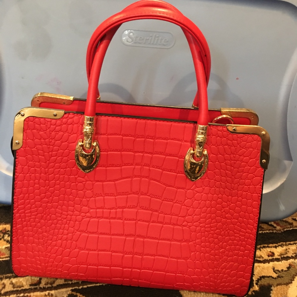Vibrant red Scarleton handbag with gold accents
